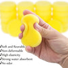 A hand holds a yellow, soft, non-deformable paint sponge against a background of stacked sponges.
