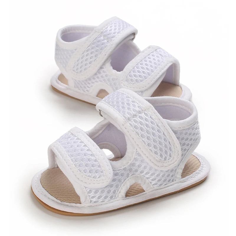 White breathable first walker sandals for baby with hook-and-loop closure and soft sole