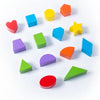 A collection of colorful wooden Montessori toys including hearts, cubes, stars, and geometric shapes arranged on a white surf