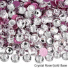 A close-up view of sparkling crystal rose gold base rhinestones in various shades of pink and silver.