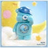 A blue Care Bear figurine with a blue cap and a crescent moon emblem, set against a yellow and light blue background.