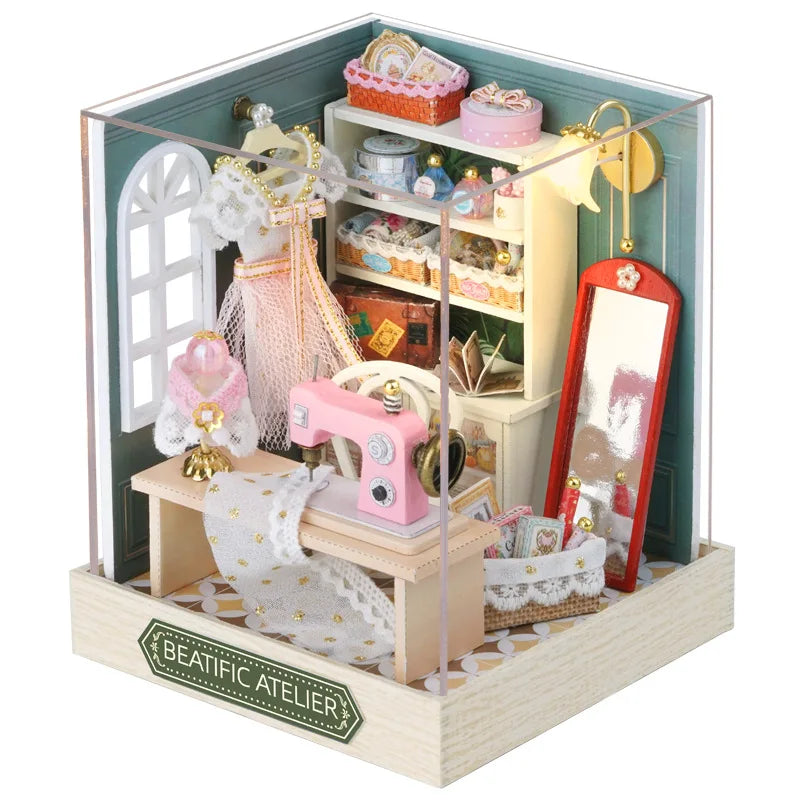 A wooden miniature dollhouse kit featuring a pink and white aesthetic with decorative elements like lace and gold accents.