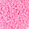 A close-up view of a large pack of pink pony beads used for jewelry making and craft projects.