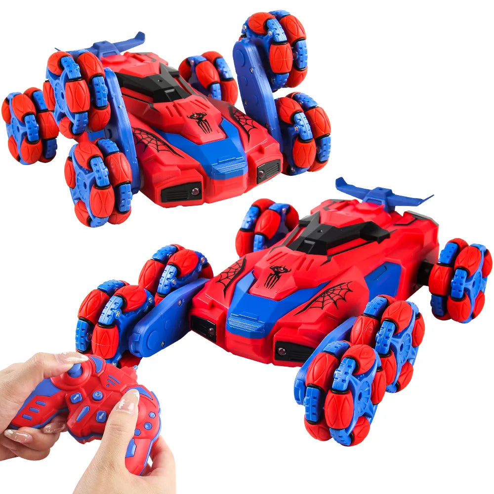 A red and blue remote control stunt car with lights and spray effect, shown being held by a hand.