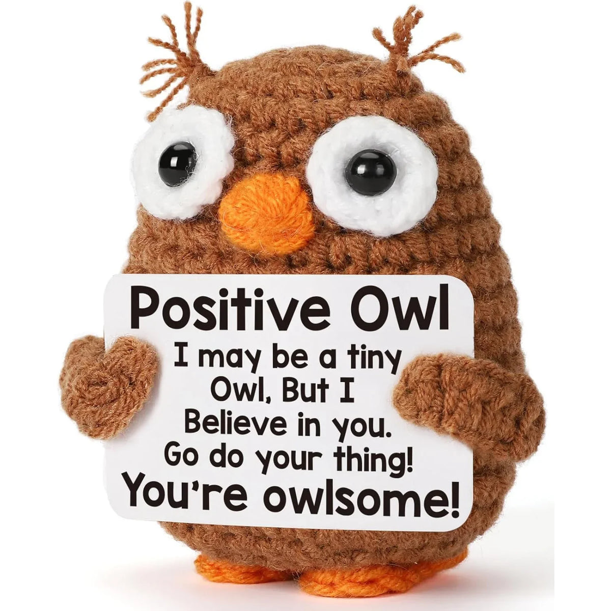 A handmade crochet owl toy with large eyes and orange beak, used as inspirational desk decor.