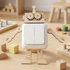 A wooden Montessori busy board for toddlers featuring gears, switches, and sensory components.