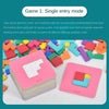 A stack of pink puzzle cards and a single pink puzzle card with building block pieces on a white surface.