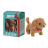 A brown plush robot puppy toy packaged in a green box with red ribbon, showing its features.