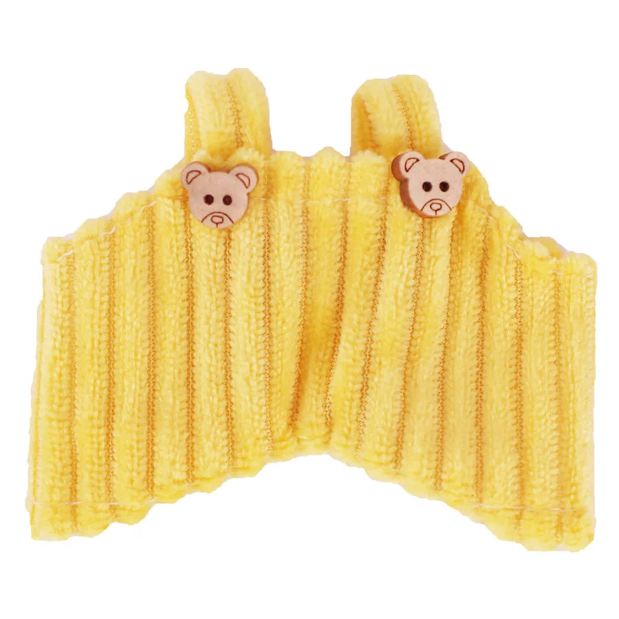 Yellow knitted strap pants for a plush doll featuring two small bear appliqués