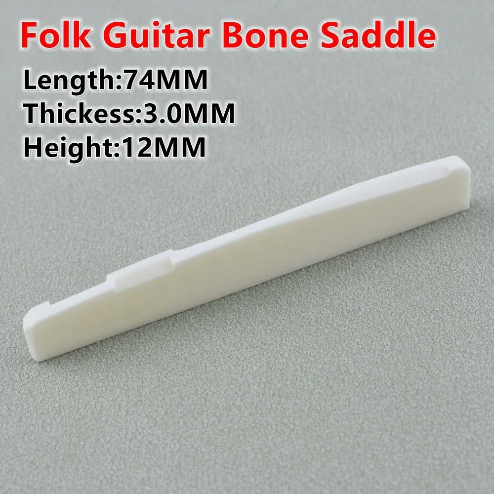 A white folk guitar bone saddle with dimensions 74mm long, 3.0mm thick, and 12mm high.
