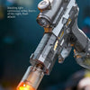 A close-up of an electric water gun firing a bright yellow stream of water and light against a dark background.