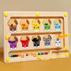 A wooden magnetic color and number maze board with various colored cups for counting