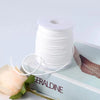 Roll of white velvet faux suede braided ribbon for crafting and gift wrapping