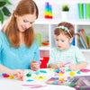 A woman is shown working with colorful polymer clay on a white table, surrounded by various sculpted pieces and tools.