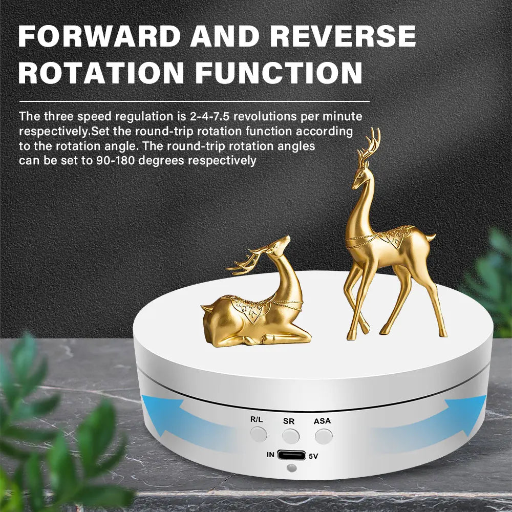 A gold-colored motorized rotating display stand with controls for forward and reverse rotation functions.