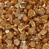 A close-up of various gold and bronze butterfly shell acrylic beads for DIY jewelry making.