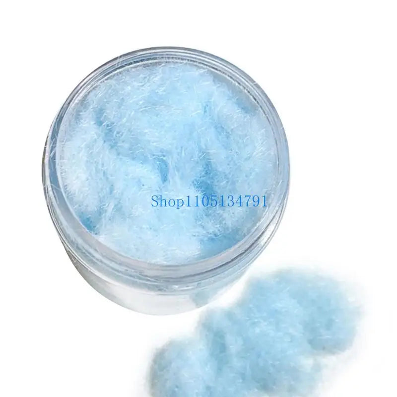 A clear jar filled with light blue adhesive flocking powder for jewelry making and crafts.