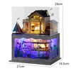 A wooden mini seaside villa dollhouse kit featuring furniture and a detailed landscape display.