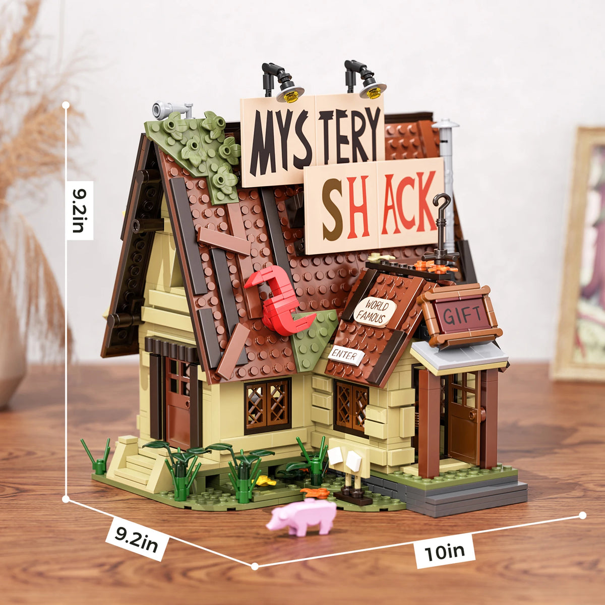 A detailed building block set of a mystery shack featuring a wooden house, roof, and various accessories.