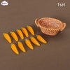 A set of miniature dollhouse vegetable baskets made of woven natural material.