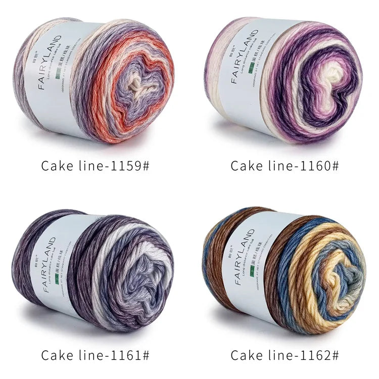 Four different spools of gradient rainbow cotton-wool yarn for knitting and crochet