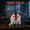 A detailed model of a haunted house built from white blocks, decorated with pumpkins and spooky elements.