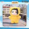 A yellow plush toy resembling a character from Jujutsu Kaisen is displayed on a light gray surface.