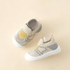 A pair of beige and gray breathable anti-slip baby first walker shoes with a woven texture.