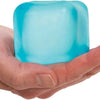 A hand holds a translucent blue slow-rebound ice cube squishy stress toy.