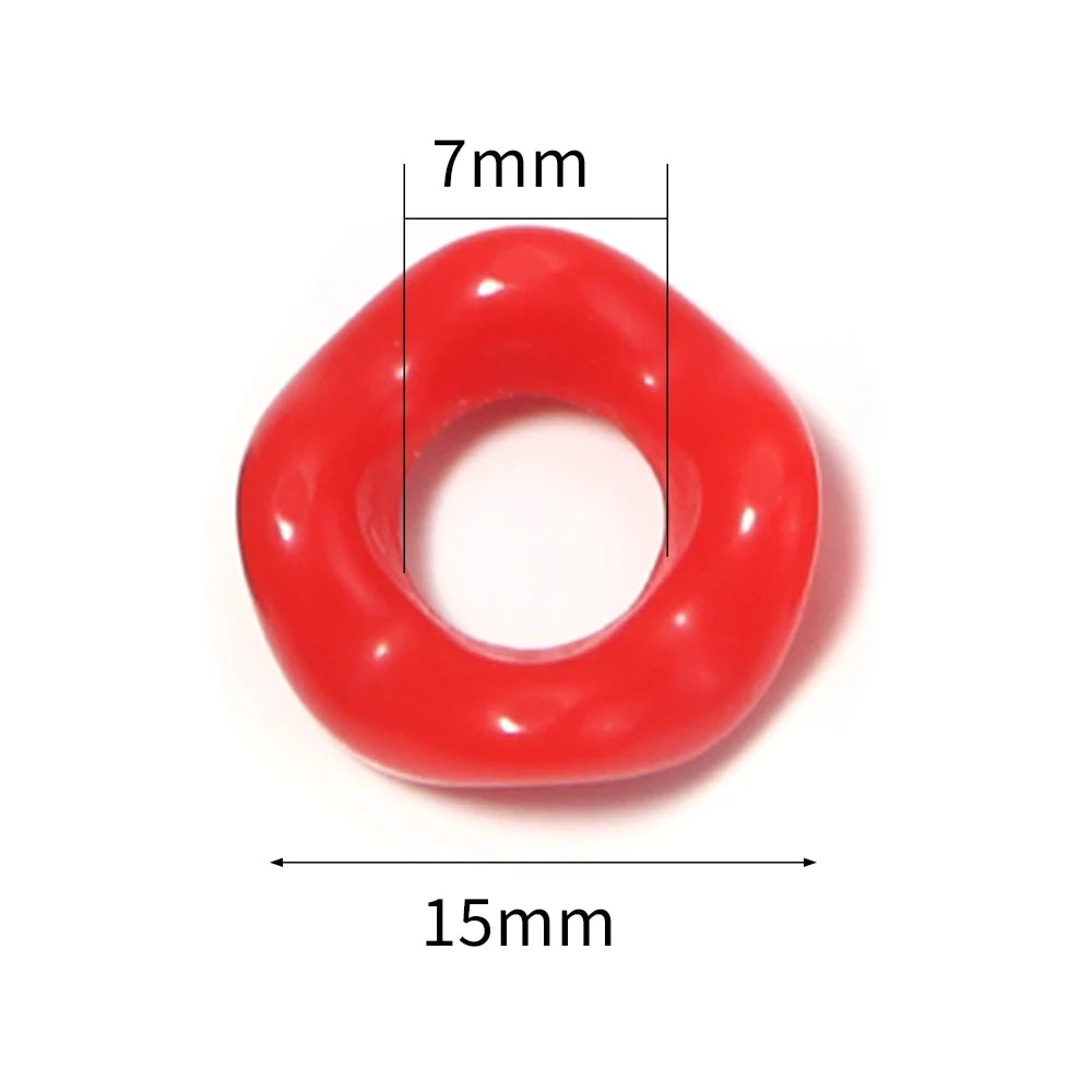 A red acrylic doughnut spacer bead with a 7mm height and 15mm diameter.