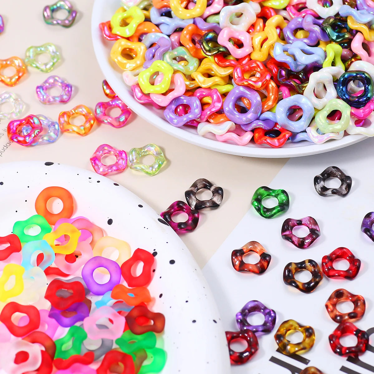 A close-up view of colorful wave-patterned acrylic beads in various shades and sizes for jewelry making.