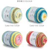 Rolls of gradient rainbow cotton-wool yarn in various shades for knitting and crochet projects