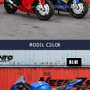 A blue 1:18 scale die-cast motorcycle model is displayed against a corrugated metal background.