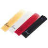 Three colored SLADE resin alto saxophone reeds displayed diagonally: yellow, white, and red.