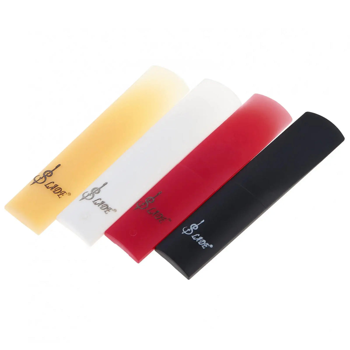 Three colored SLADE resin alto saxophone reeds displayed diagonally: yellow, white, and red.