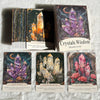 A collection of Crystals Wisdom Oracle Cards featuring amethyst, clear quartz, and rose quartz stones.