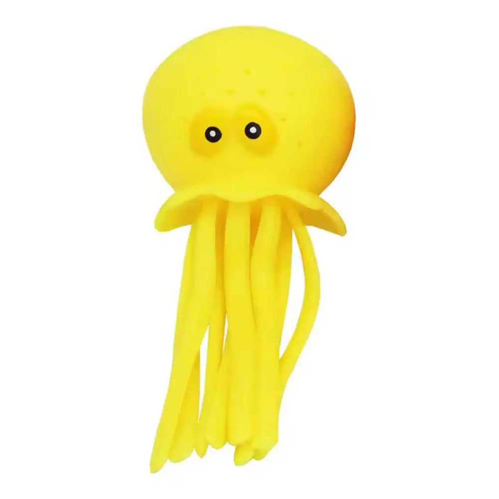 A bright yellow silicone octopus bath toy that sprays water.
