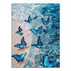 A close-up of blue butterflies swimming in clear water against a light, sandy background.