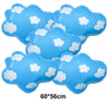 A set of light blue foil balloon clouds with white cloud shapes for birthday party decor