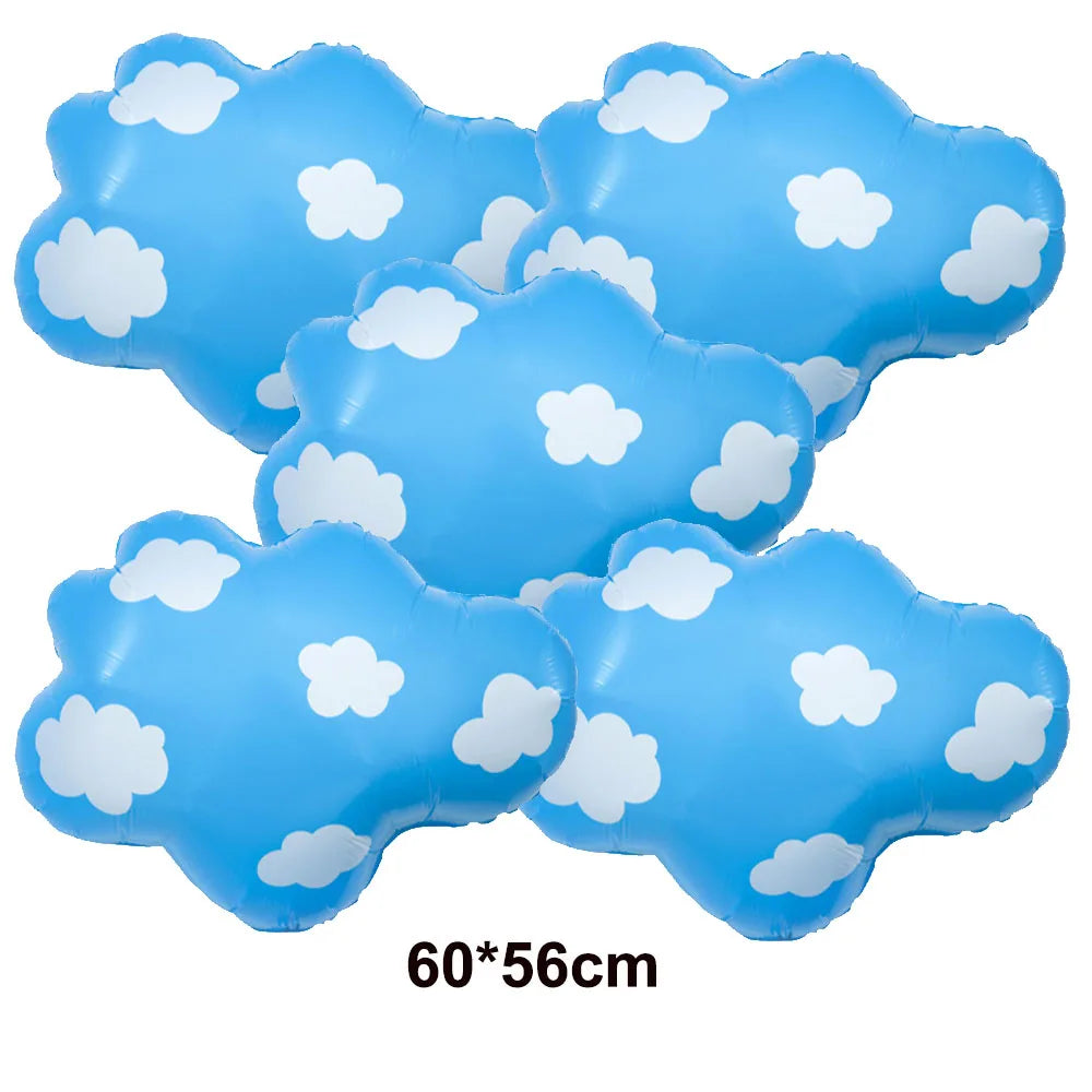 A set of light blue foil balloon clouds with white cloud shapes for birthday party decor