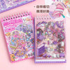 A pink and purple spiral notebook filled with 3D stacking miniature scene stickers and a separate sheet of stickers.