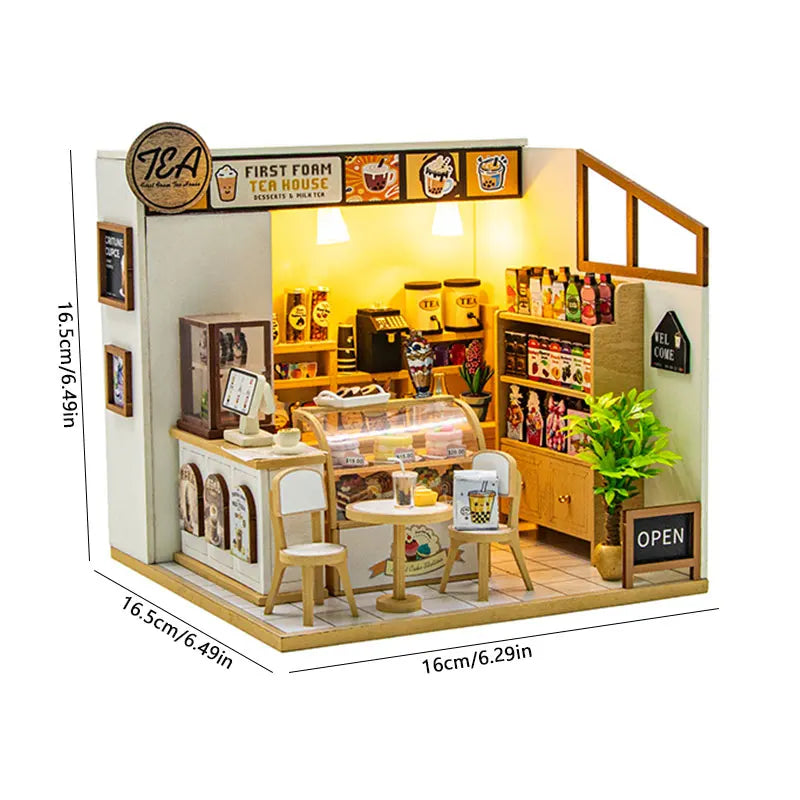 A miniature dollhouse kit featuring a tea house theme with furniture and warm lighting.