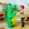 A green inflatable dinosaur punching bag is being playfully interacted with by a young boy in a brightly lit room.