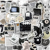 A collection of minimalist black and white stickers, including clocks, cameras, celestial bodies, and various graphic element