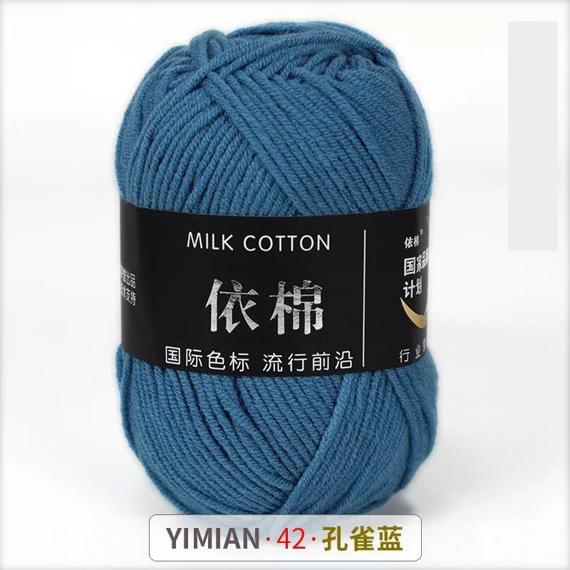 A skein of blue milk cotton yarn labeled YIMIAN 42, ready for knitting or crochet.