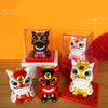 A set of solar-powered shaking head lion figurines in various colors and styles displayed in clear acrylic boxes.