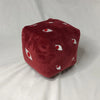 A deep red plush figure shaped like a cube with white eyes and red irises, featuring Jujutsu Kaisen Gojo.