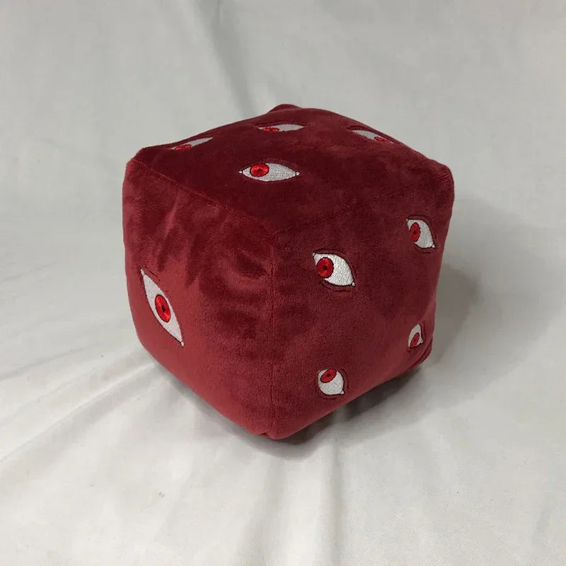 A deep red plush figure shaped like a cube with white eyes and red irises, featuring Jujutsu Kaisen Gojo.