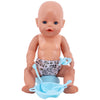 A baby doll with a pink skin tone is shown sitting down with a blue feeding and care accessory set.