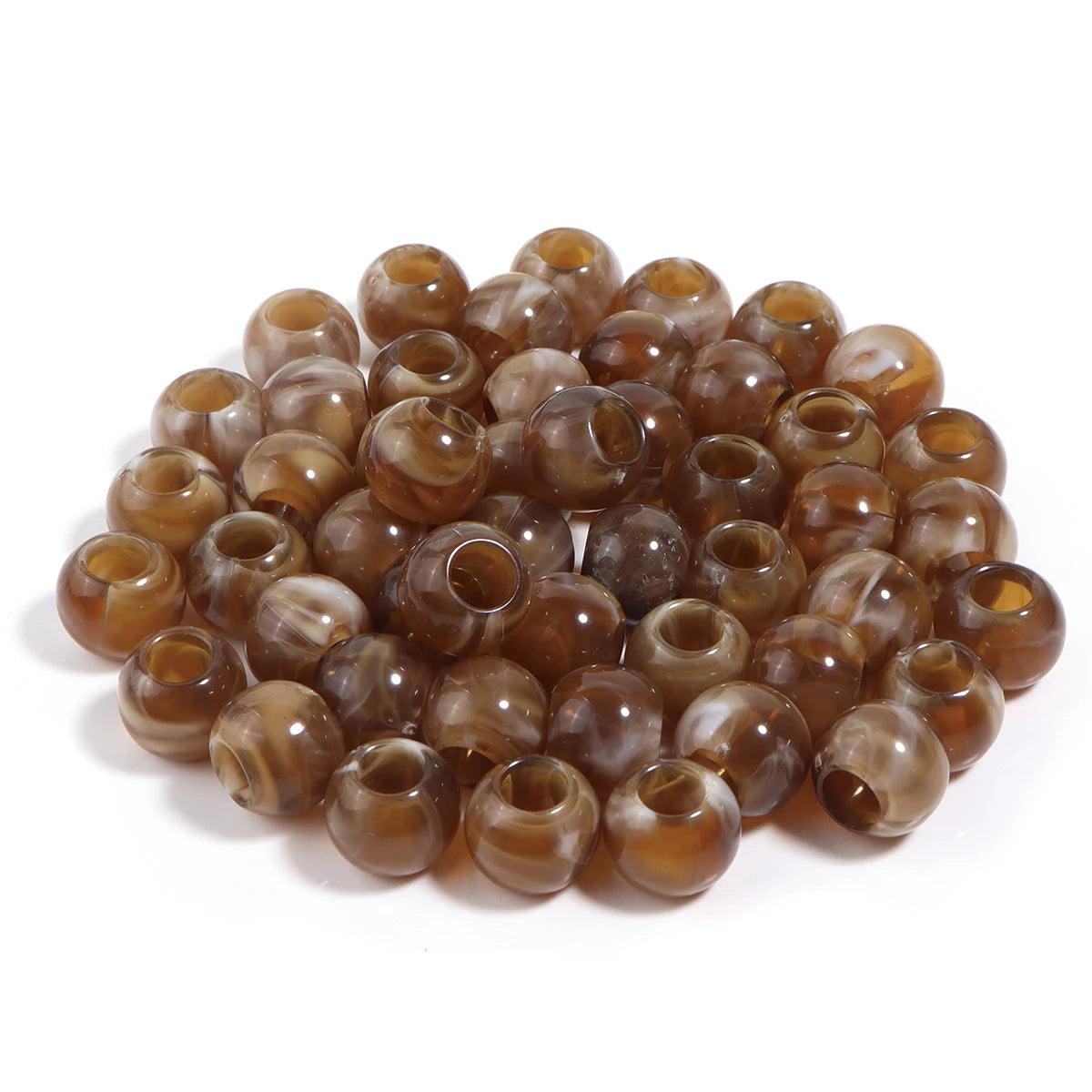 A pile of 50 imitation jade acrylic cloud beads in various shades of brown and amber for jewelry making.